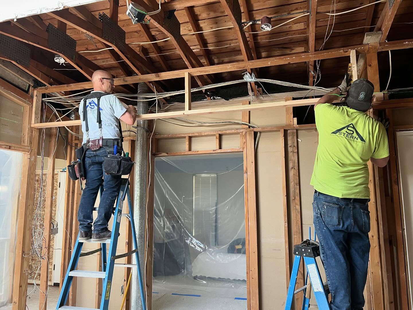 Team carrying custom panel on site